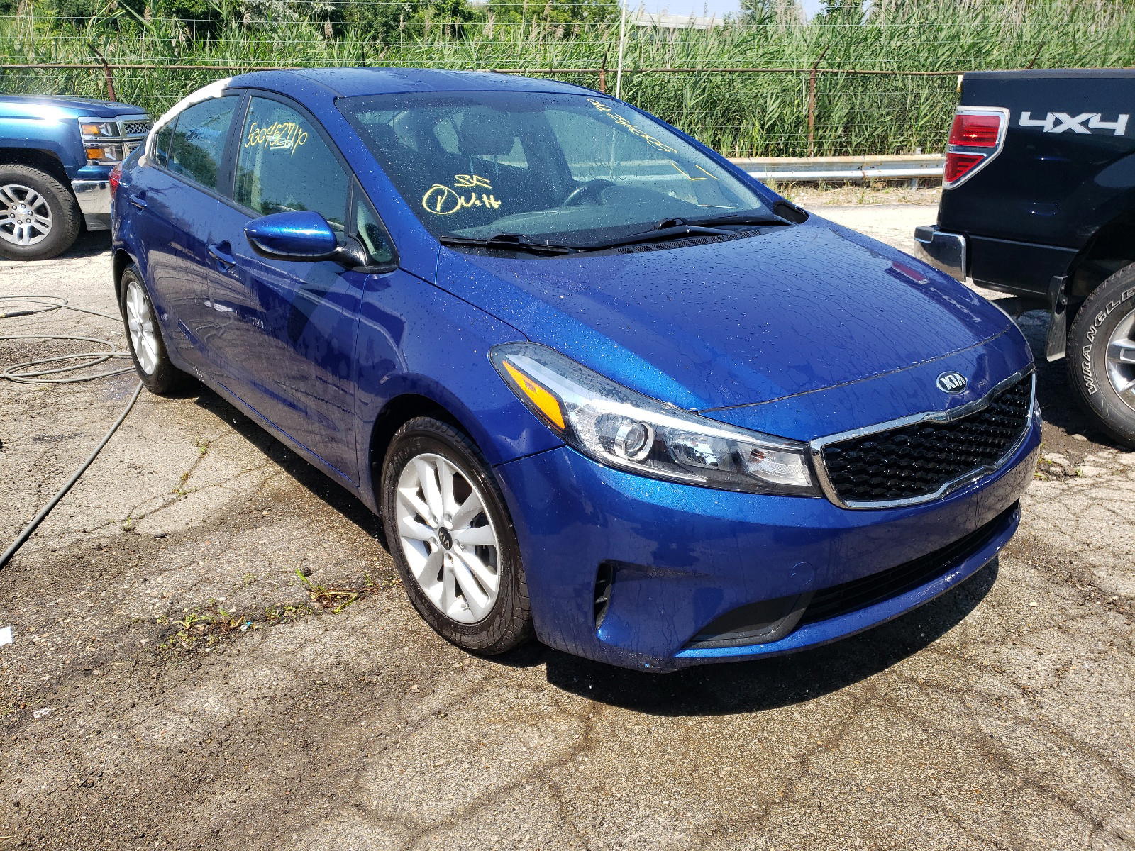 KIA FORTE 2017 with VIN 3KPFL4A75HE027301 - Photo from auction