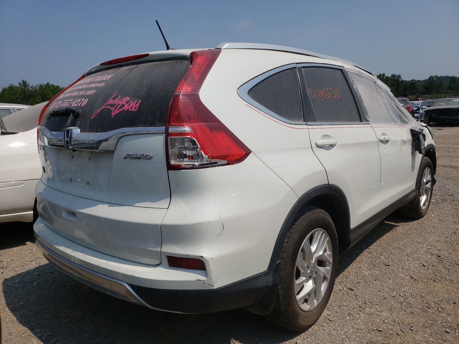 Photo 4 from auction – 2015 HONDA CR-V EXL with VIN 5J6RM4H75FL028804