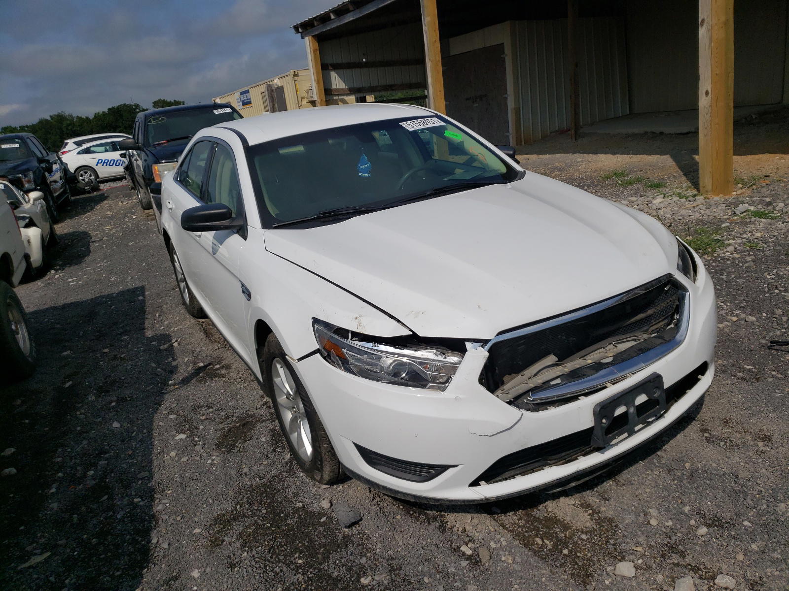 FORD TAURUS SE 2015 with VIN 1FAHP2D83FG122724 - Photo from auction