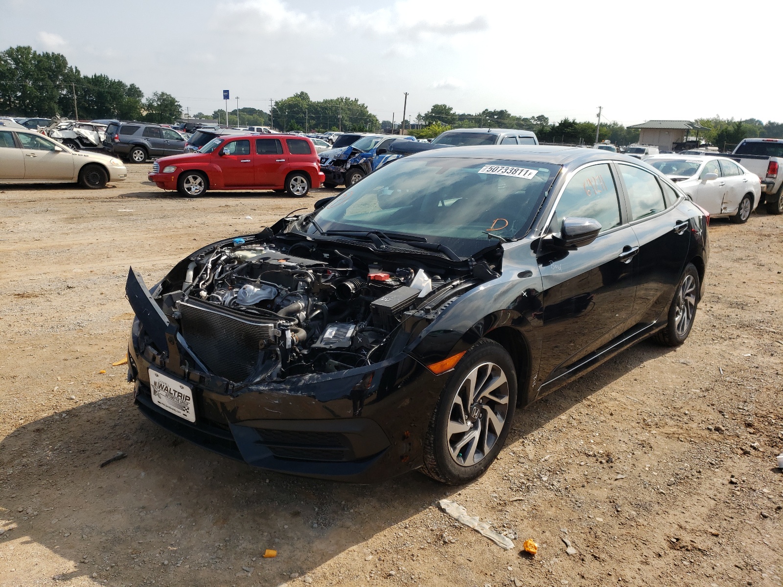 Photo 2 from auction – 2018 HONDA CIVIC EX with VIN 19XFC2F79JE003148