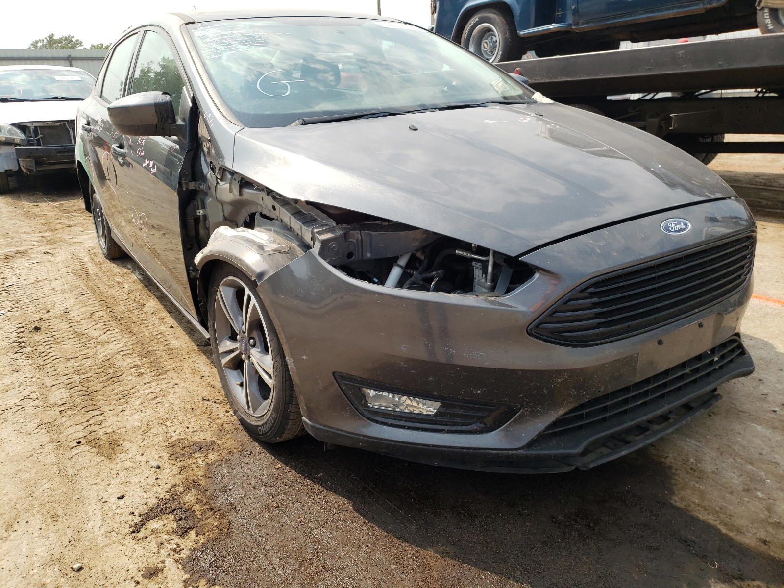 FORD FOCUS SE 2018 with VIN 1FADP3FE1JL204586 - Photo from auction