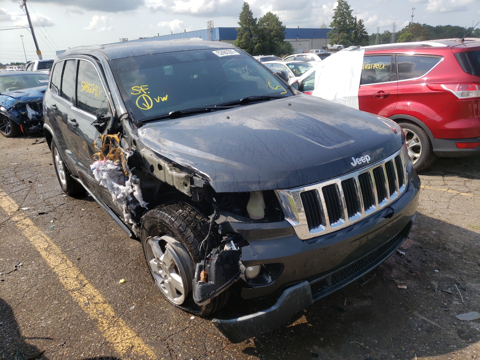 JEEP GRAND CHER 2011 with VIN 1J4RR4GG0BC585987 - Photo from auction