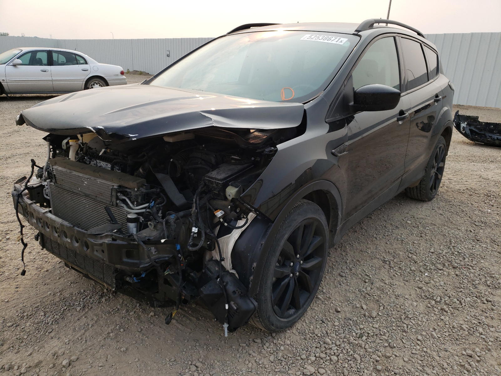 Photo 2 from auction – 2018 FORD ESCAPE SE with VIN 1FMCU9GD8JUA85576