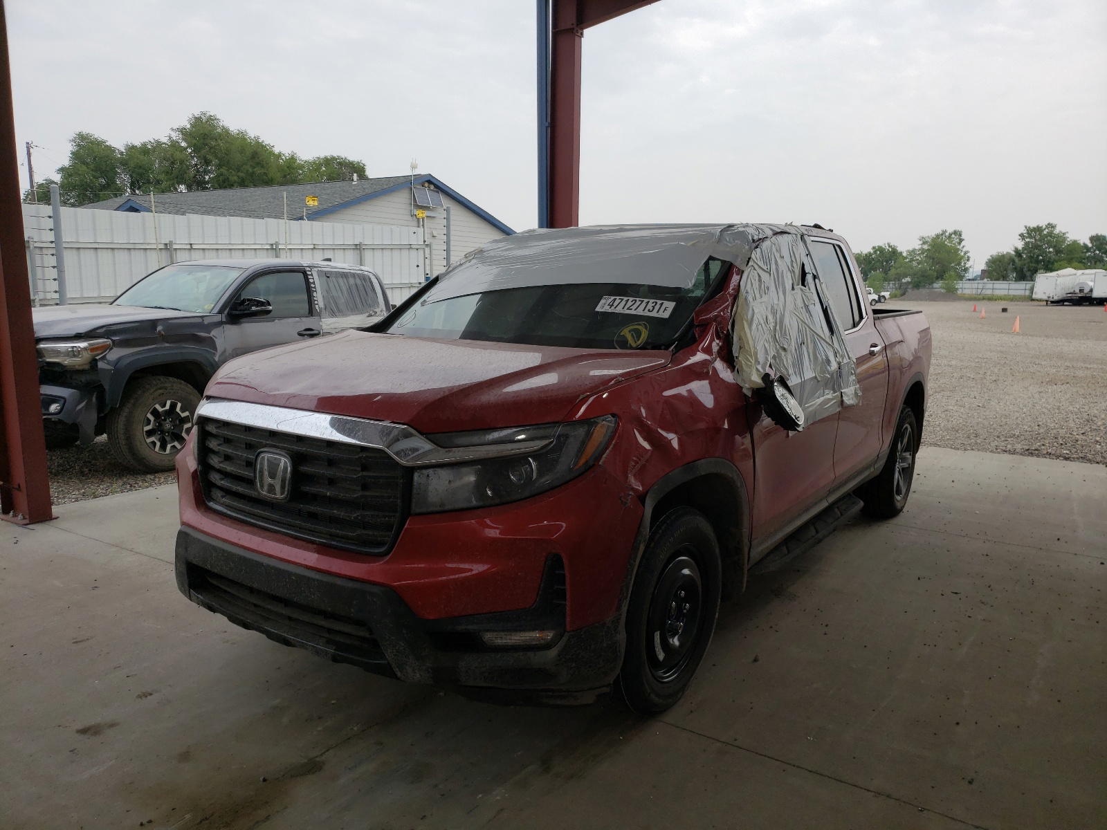 Photo 2 from auction – 2021 HONDA RIDGELINE with VIN 5FPYK3F74MB011147