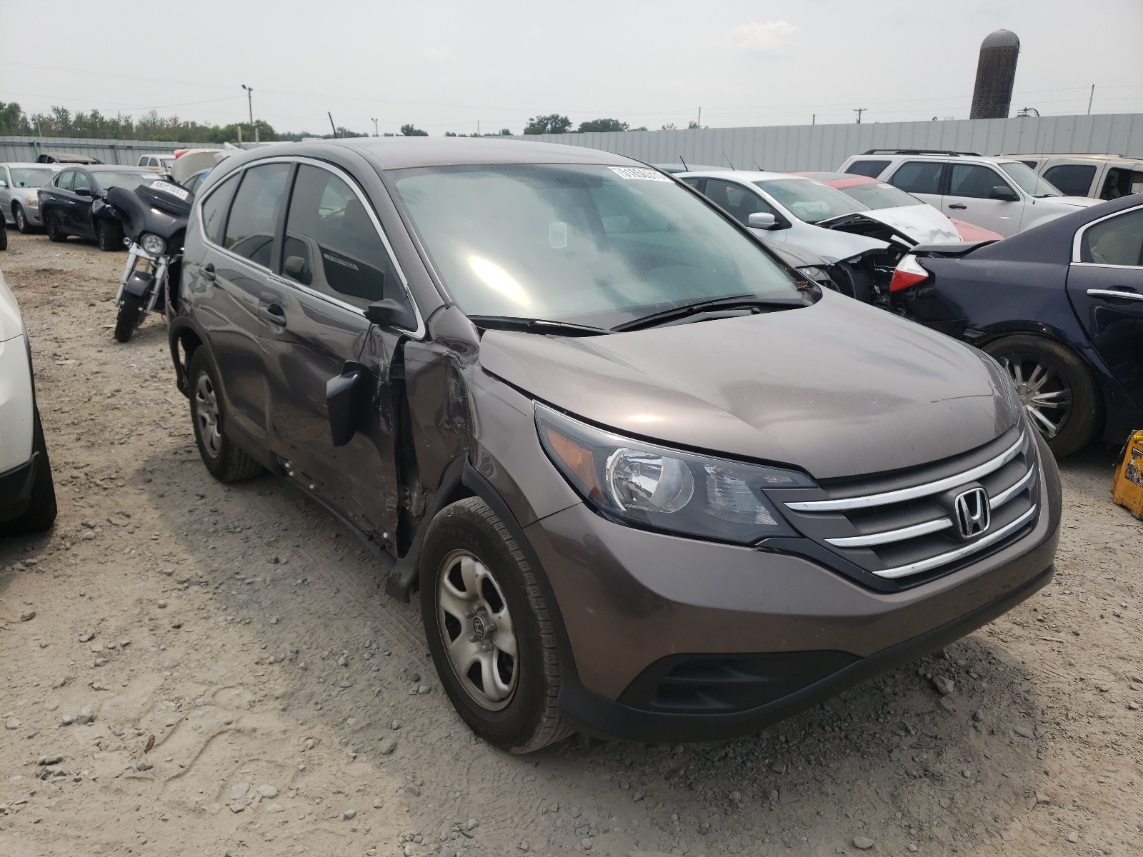 HONDA CR-V LX 2014 with VIN 2HKRM3H33EH518318 - Photo from auction