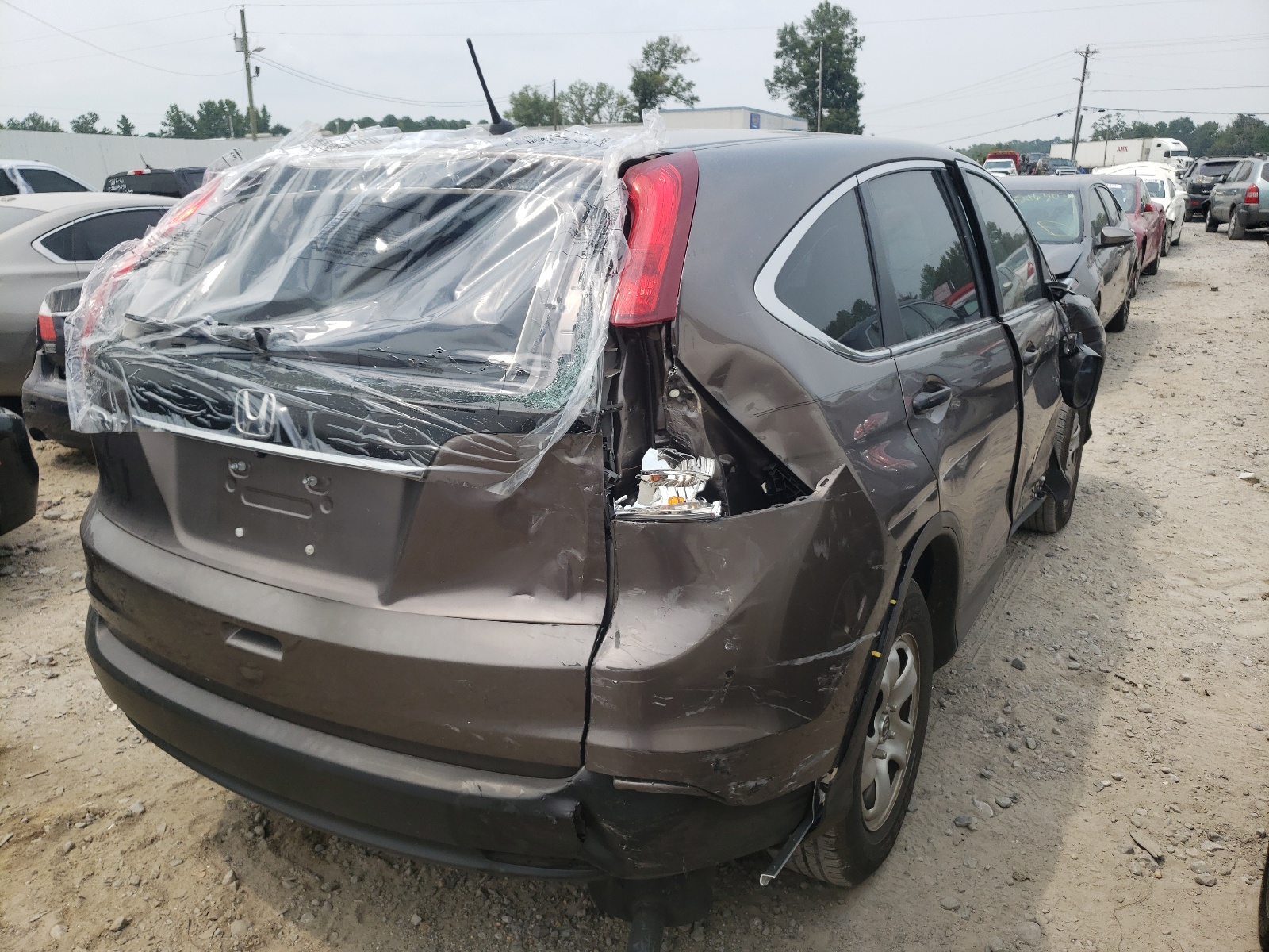 Photo 4 from auction – 2014 HONDA CR-V LX with VIN 2HKRM3H33EH518318