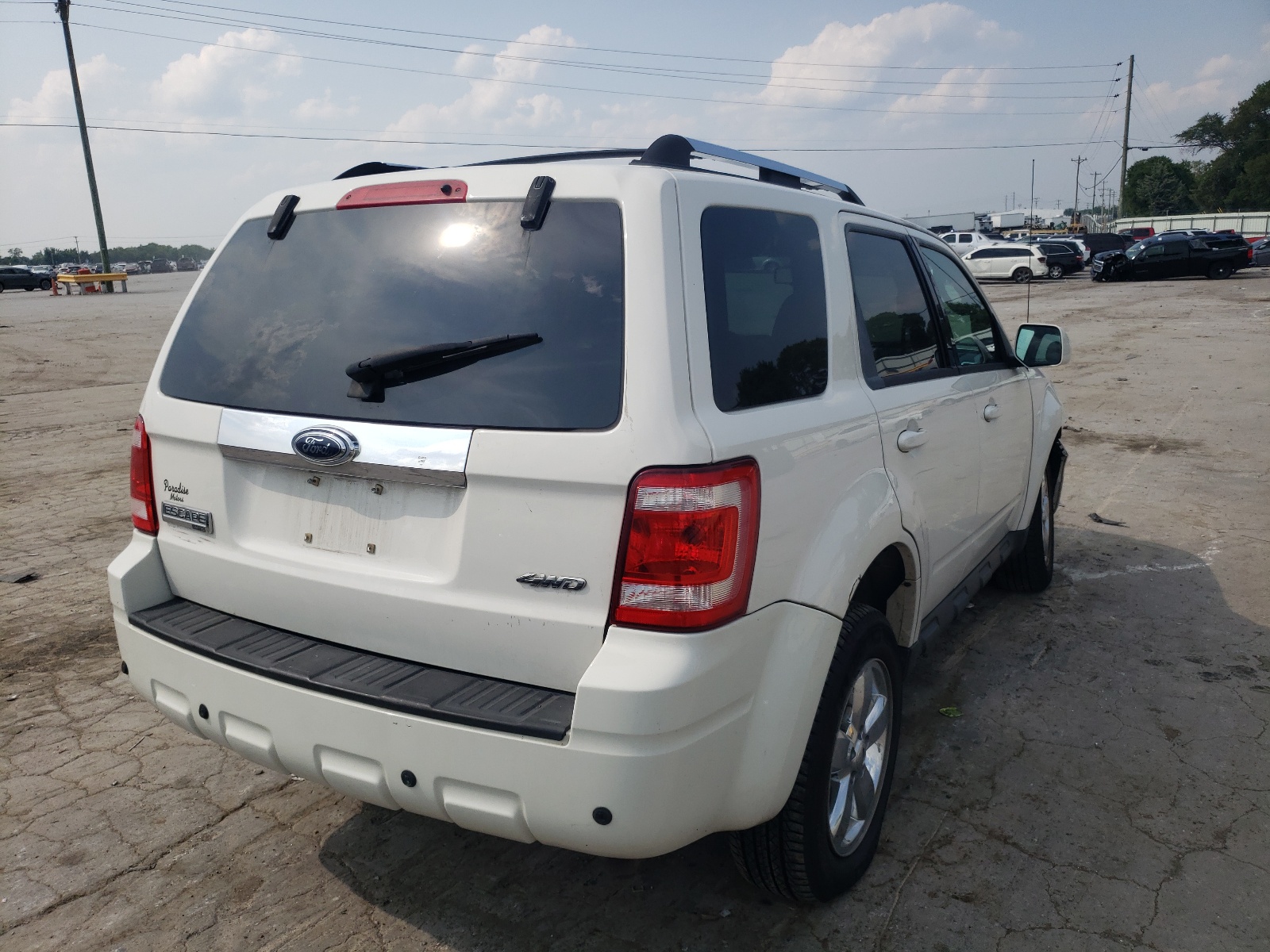 Photo 4 from auction – 2009 FORD ESCAPE LIM with VIN 1FMCU94G29KA05050