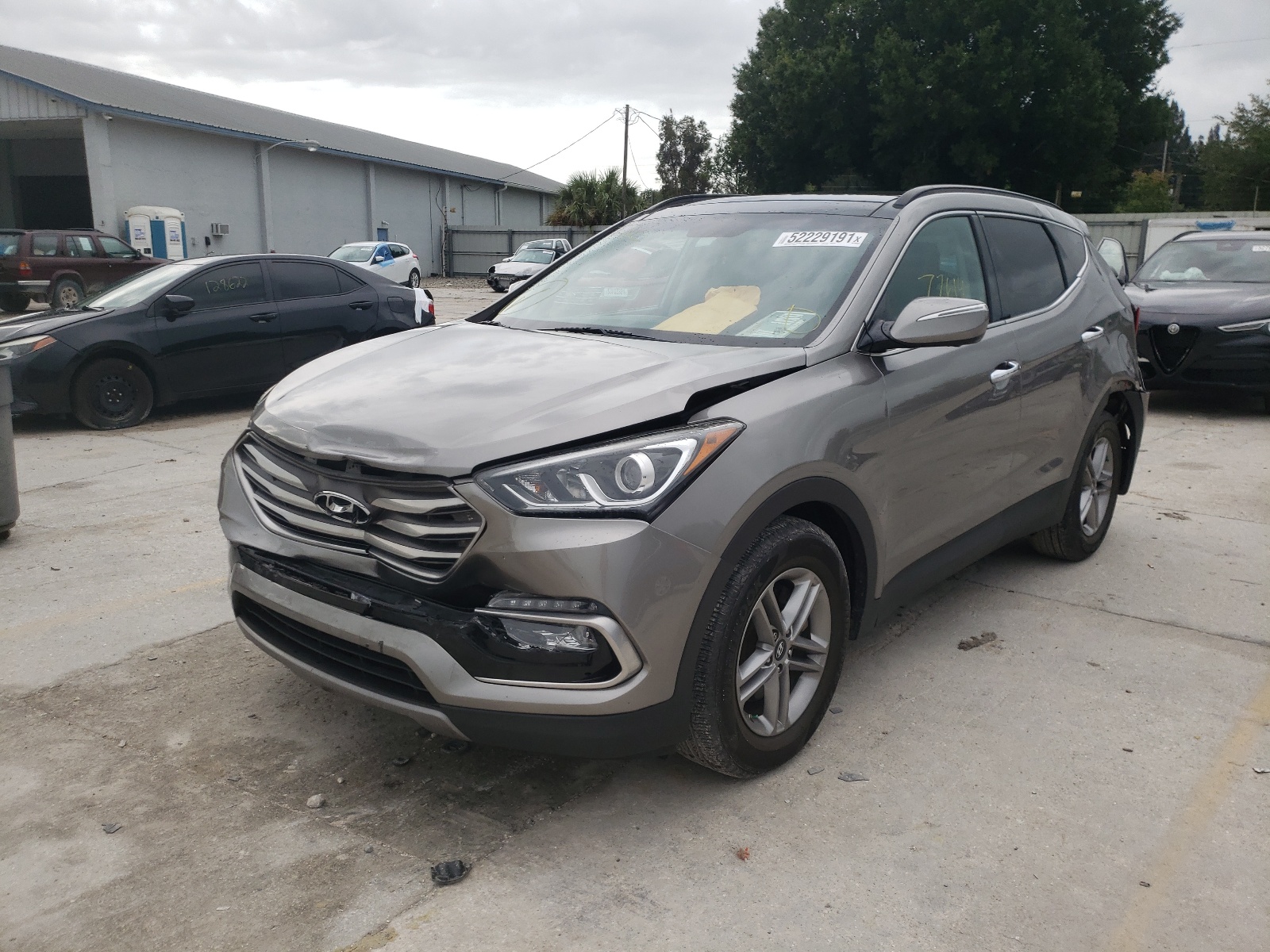 Photo 2 from auction – 2017 HYUNDAI SANTA FE S with VIN 5NMZU3LB6HH041657