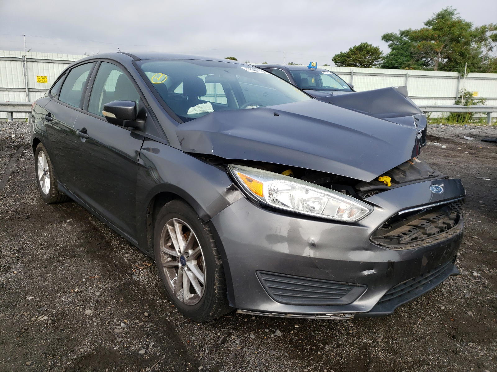 FORD FOCUS SE 2015 with VIN 1FADP3F24FL259997 - Photo from auction