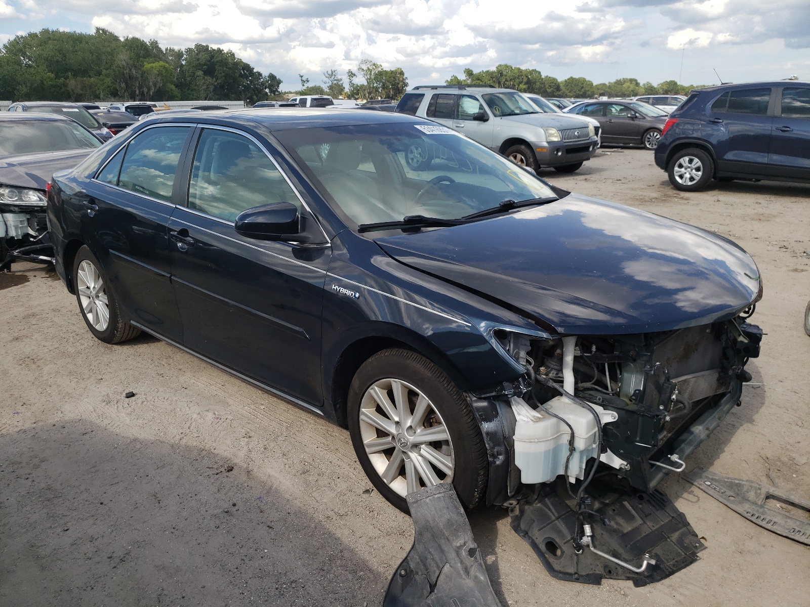TOYOTA CAMRY HYBR 2012 with VIN 4T1BD1FK5CU058349 - Photo from auction