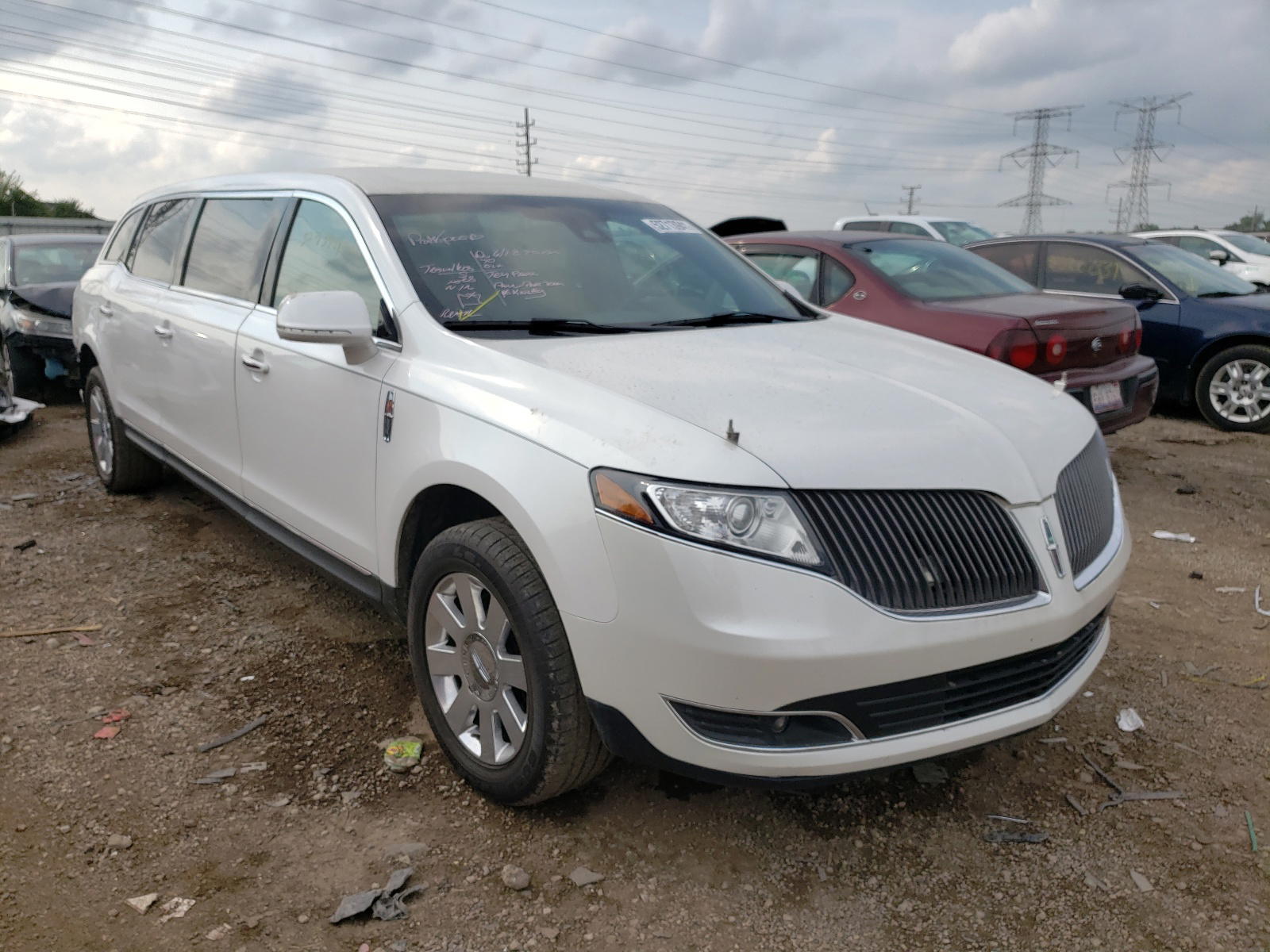 LINCOLN MKT 2014 with VIN 2L1MJ5LK3EBL57457 - Photo from auction