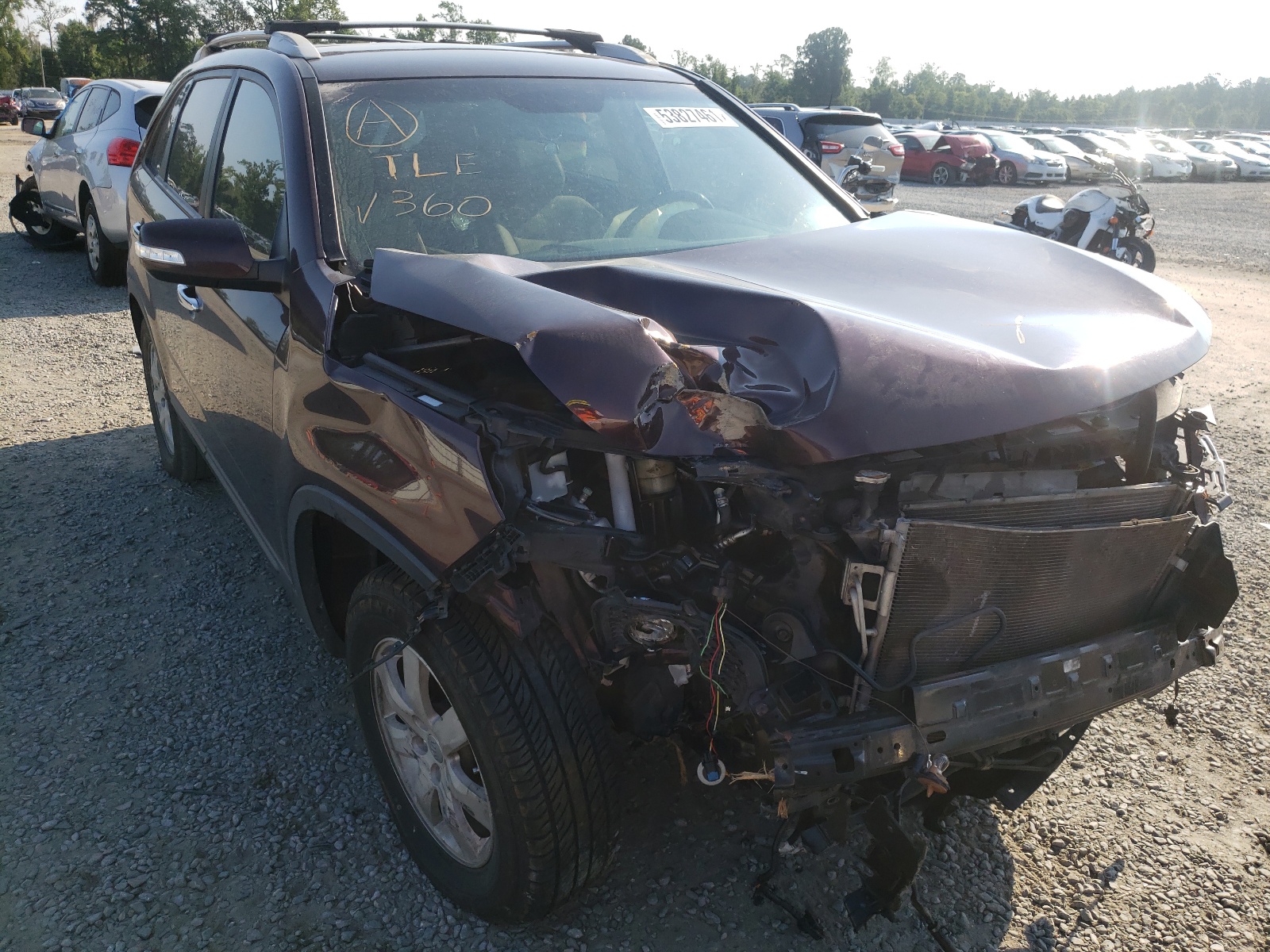 KIA SORENTO LX 2013 with VIN 5XYKT3A60DG338129 - Photo from auction
