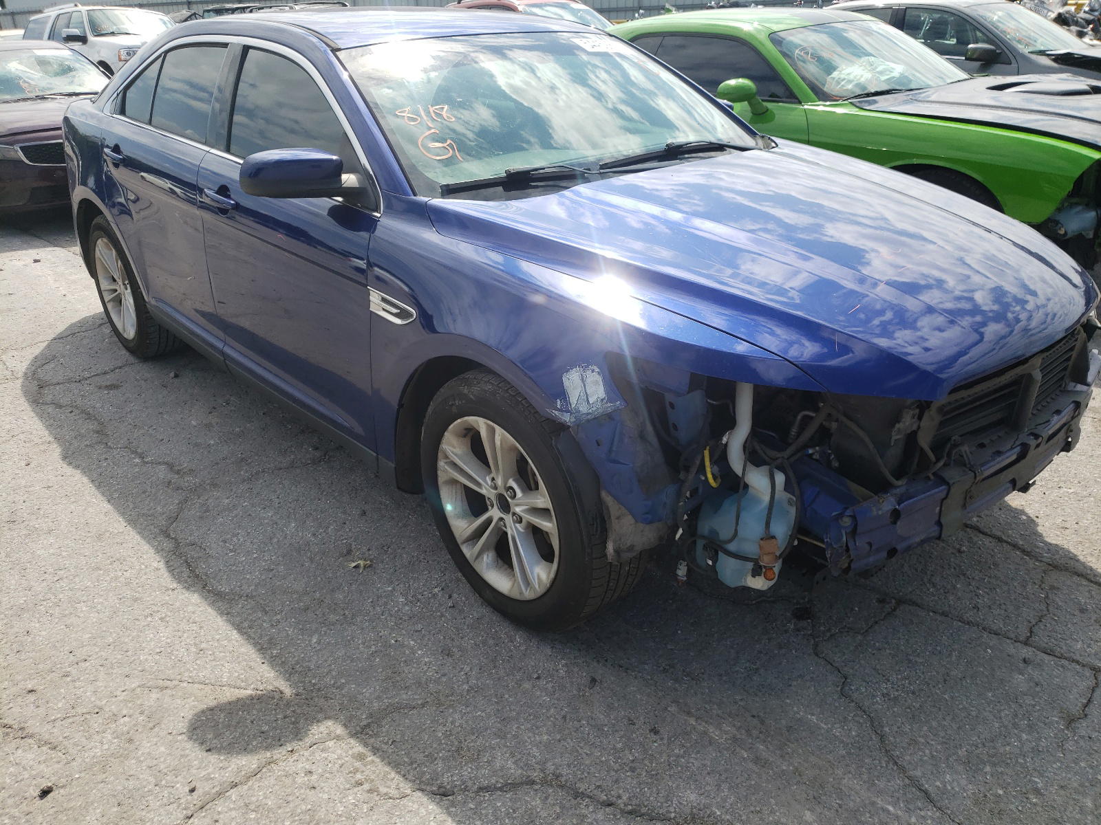 FORD TAURUS SEL 2014 with VIN 1FAHP2H82EG160034 - Photo from auction