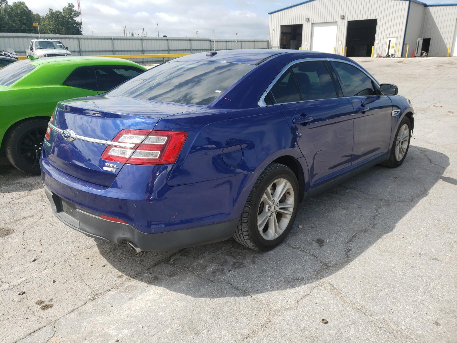 Photo 4 from auction – 2014 FORD TAURUS SEL with VIN 1FAHP2H82EG160034