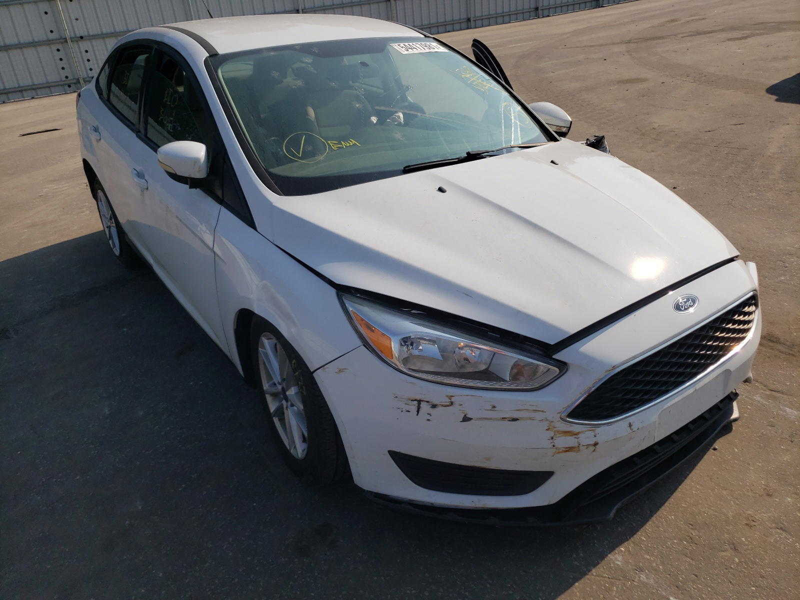 FORD FOCUS SE 2016 with VIN 1FADP3F25GL300610 - Photo from auction