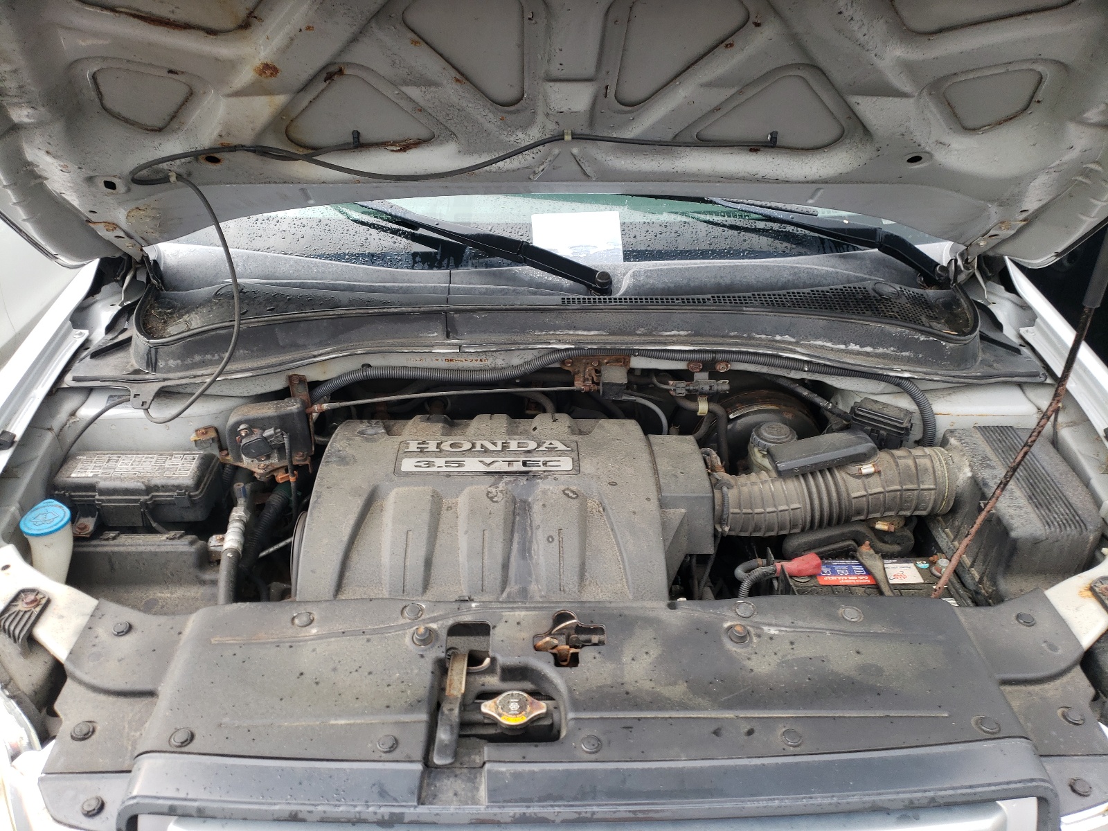 Photo 7 from auction – 2006 HONDA PILOT LX with VIN 2HKYF18106H552940