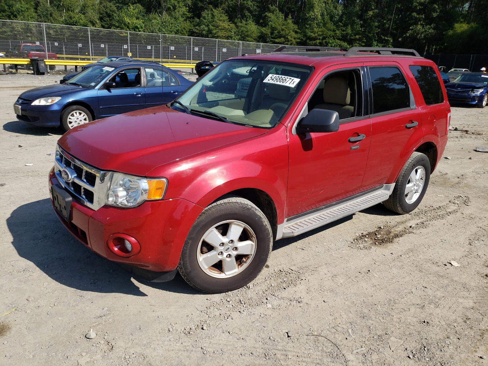 Photo 2 from auction – 2010 FORD ESCAPE with VIN 1FMCU9D71AKD16215