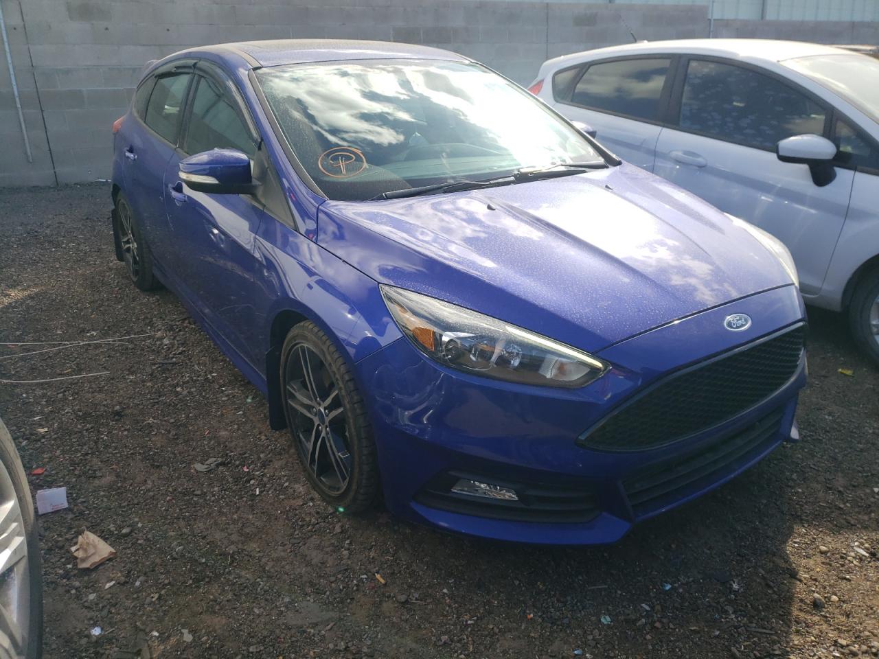 FORD FOCUS ST 2015 with VIN 1FADP3L91FL322703 - Photo from auction