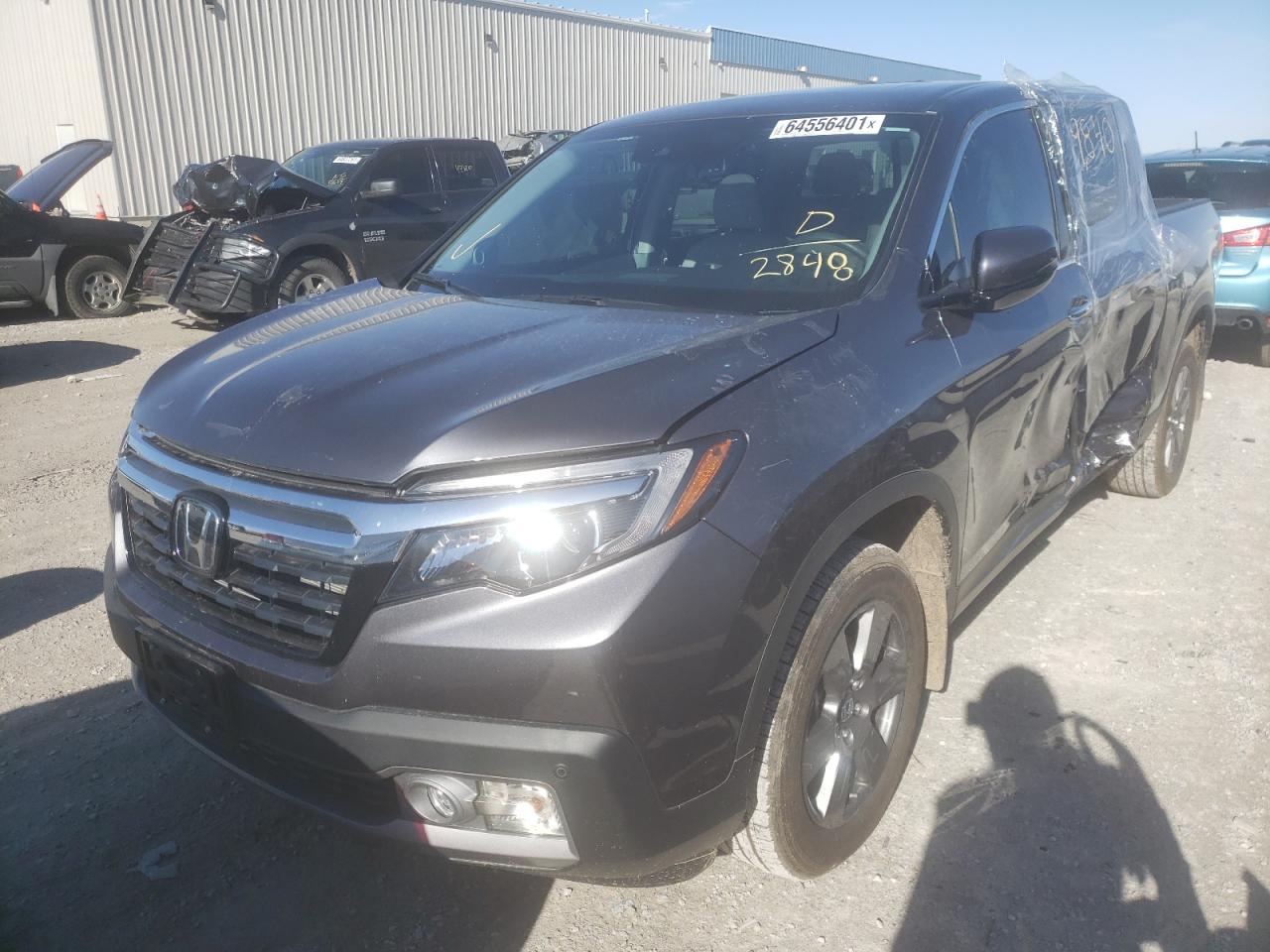 Photo 2 from auction – 2020 HONDA RIDGELINE with VIN 5FPYK3F78LB012848