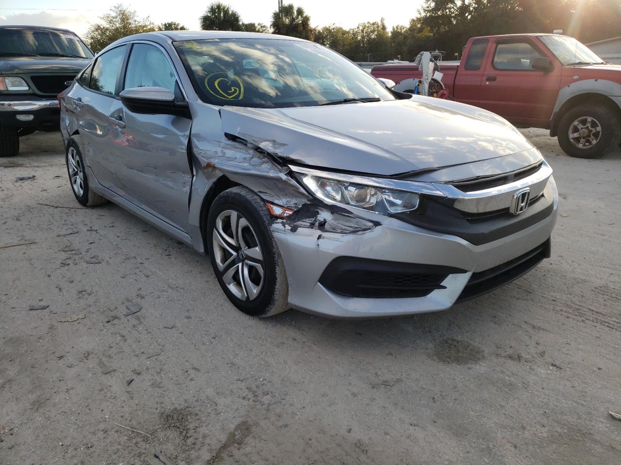 HONDA CIVIC LX 2018 with VIN 19XFC2F57JE024028 - Photo from auction