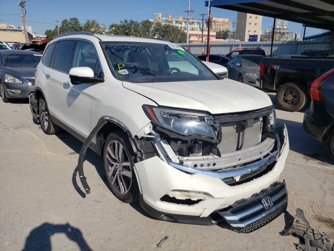 HONDA PILOT TOUR 2018 with VIN 5FNYF5H9XJB010572 - Photo from auction