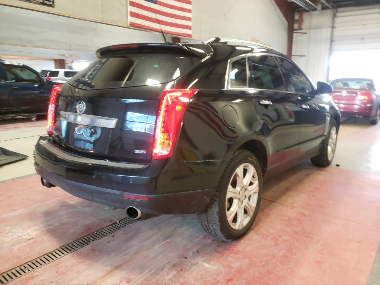 Photo 4 from auction – 2013 CADILLAC SRX with VIN 3GYFNJE30DS653506