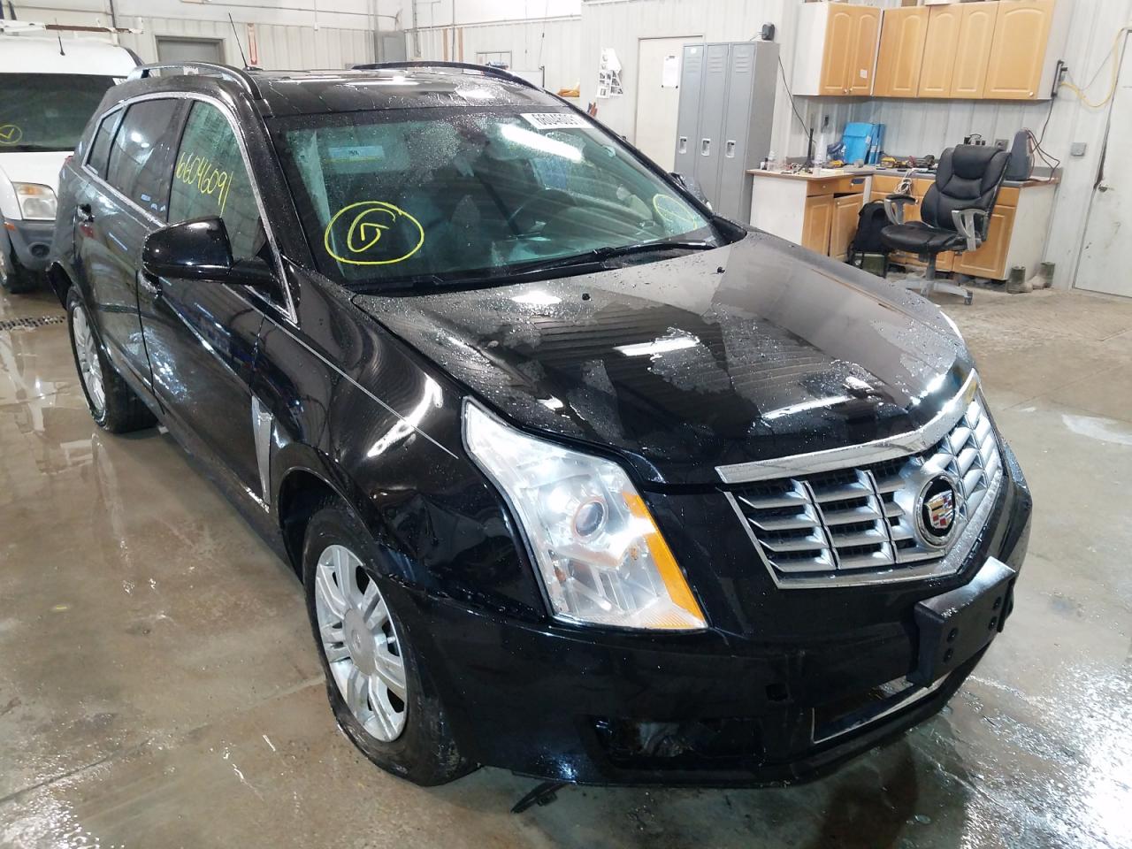 CADILLAC SRX 2015 with VIN 3GYFNAE32FS637245 - Photo from auction