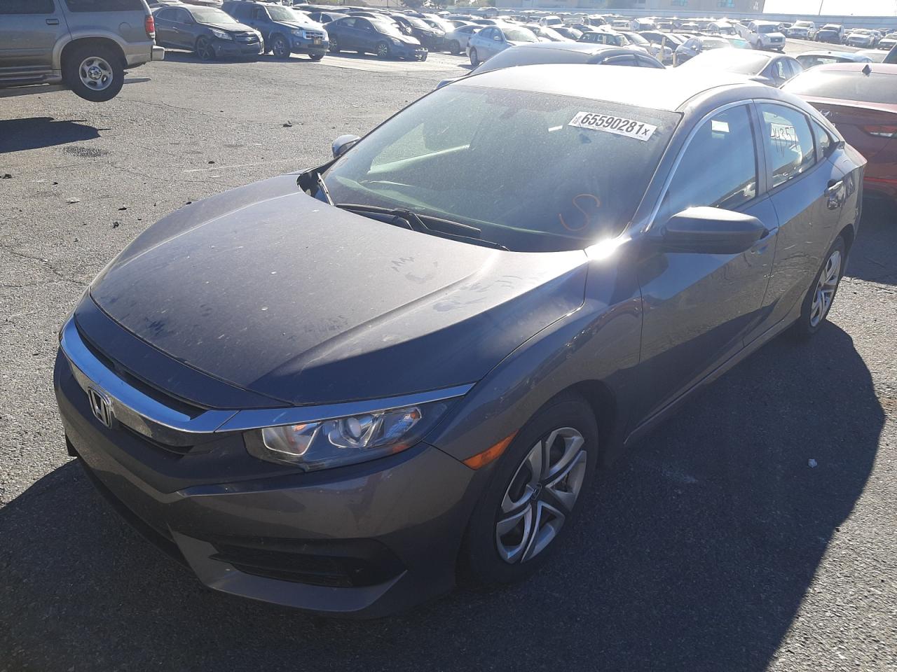 Photo 2 from auction – 2018 HONDA CIVIC LX with VIN 19XFC2F57JE002966