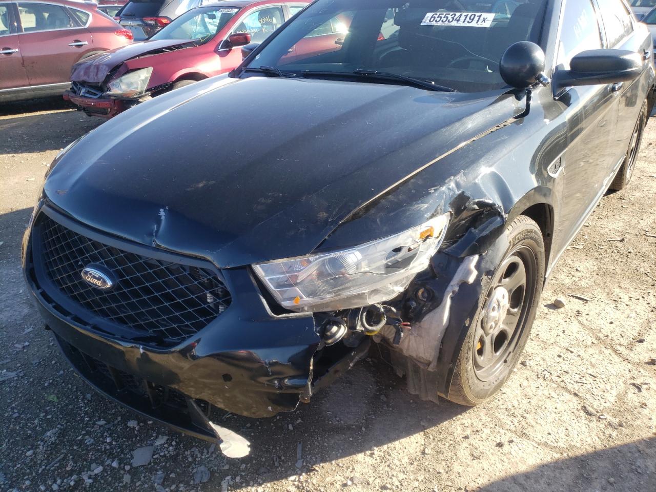 Photo 9 from auction – 2014 FORD TAURUS POL with VIN 1FAHP2MT6EG149063