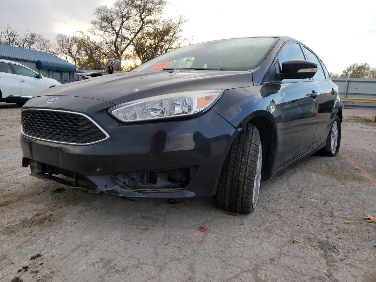 Photo 2 from auction – 2015 FORD FOCUS SE with VIN 1FADP3K25FL227551