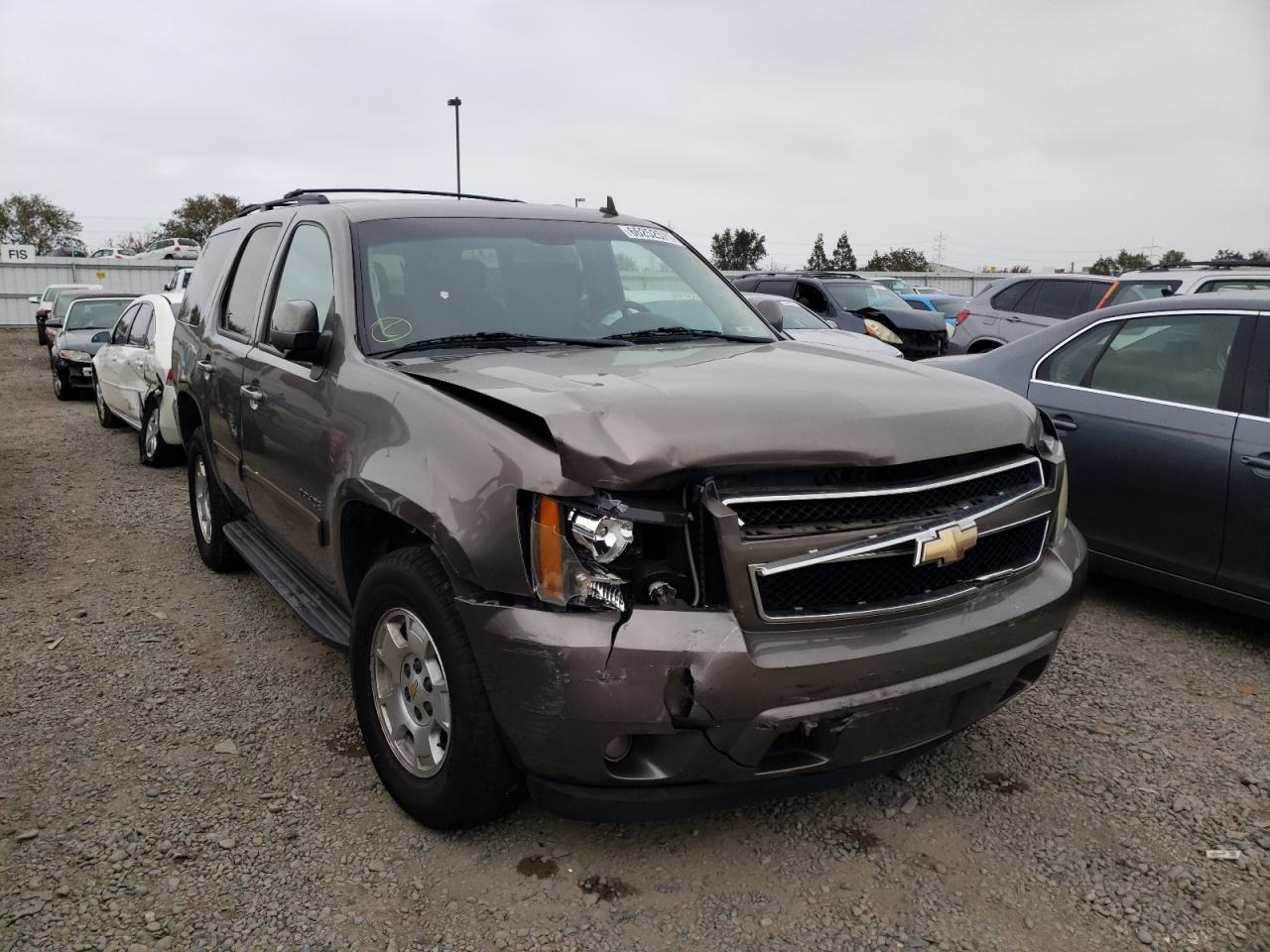 CHEVROLET TAHOE C150 2011 with VIN 1GNSCAE02BR128096 - Photo from auction