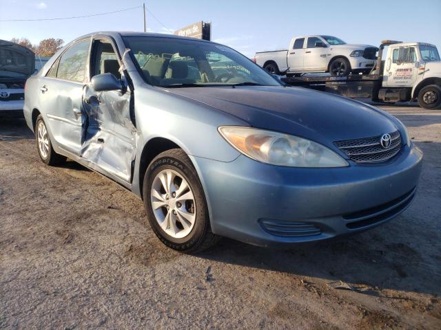 TOYOTA CAMRY LE 2004 with VIN 4T1BF32KX4U569259 - Photo from auction