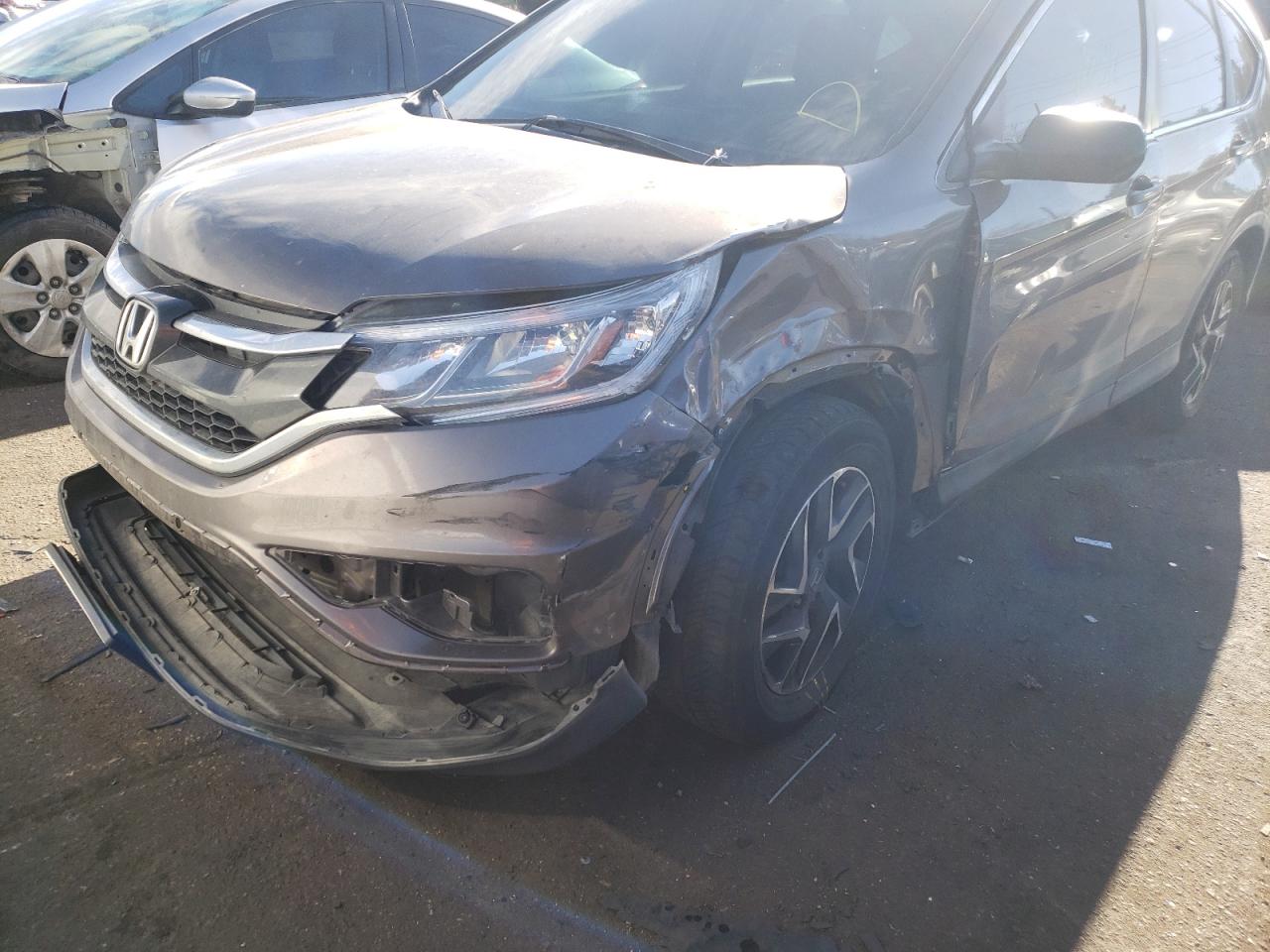Photo 9 from auction – 2016 HONDA CR-V SE with VIN 2HKRM4H42GH697839