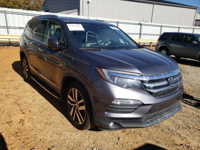 HONDA PILOT TOUR 2017 with VIN 5FNYF6H99HB035513 - Photo from auction