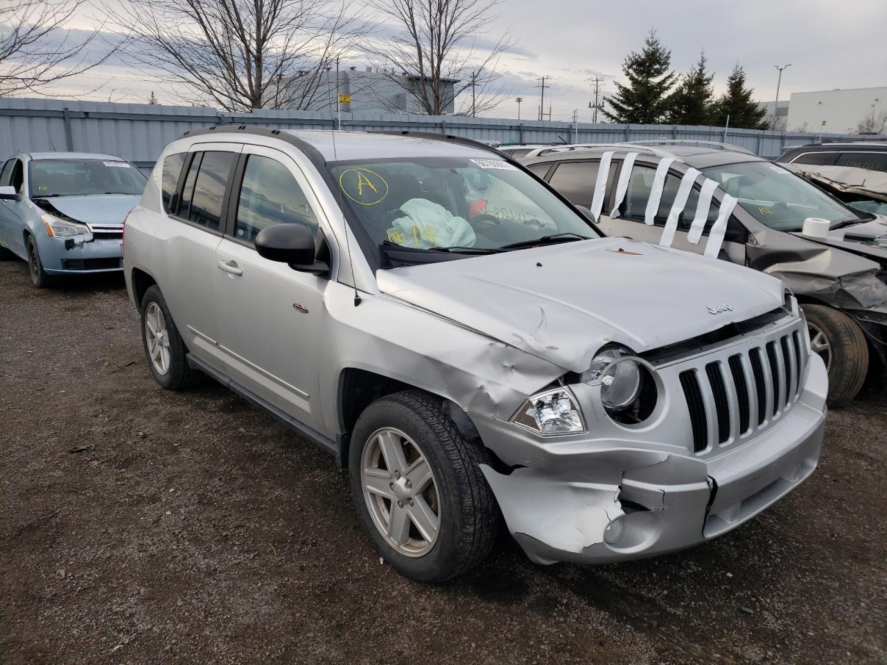 JEEP COMPASS SP 2010 with VIN 1J4NF4FB4AD653794 - Photo from auction