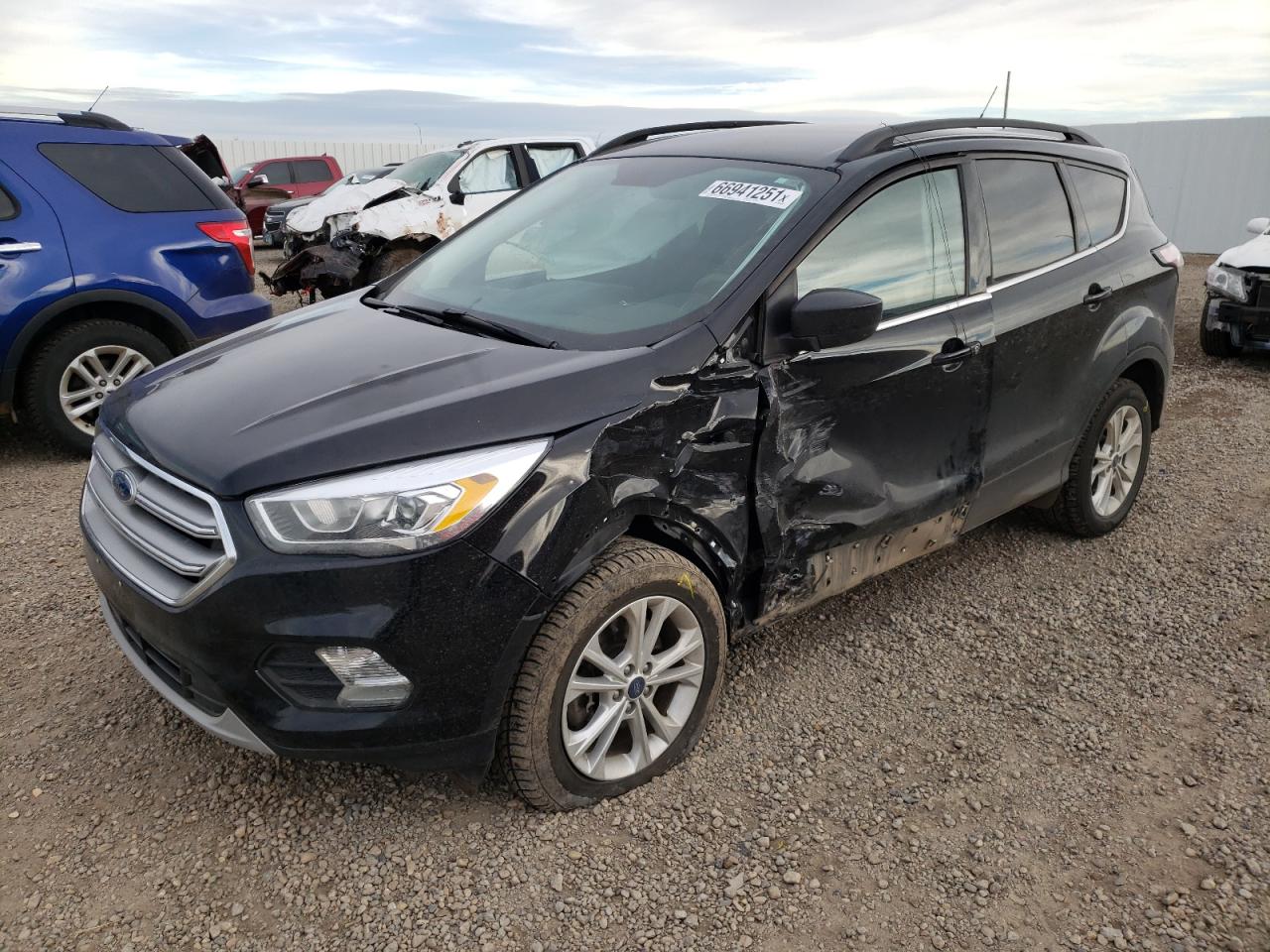 Photo 2 from auction – 2017 FORD ESCAPE SE with VIN 1FMCU9GD4HUB64155