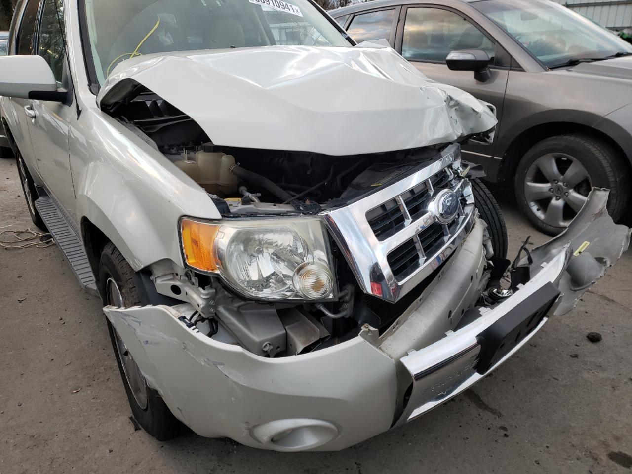 Photo 9 from auction – 2009 FORD ESCAPE LIM with VIN 1FMCU94G39KA62728