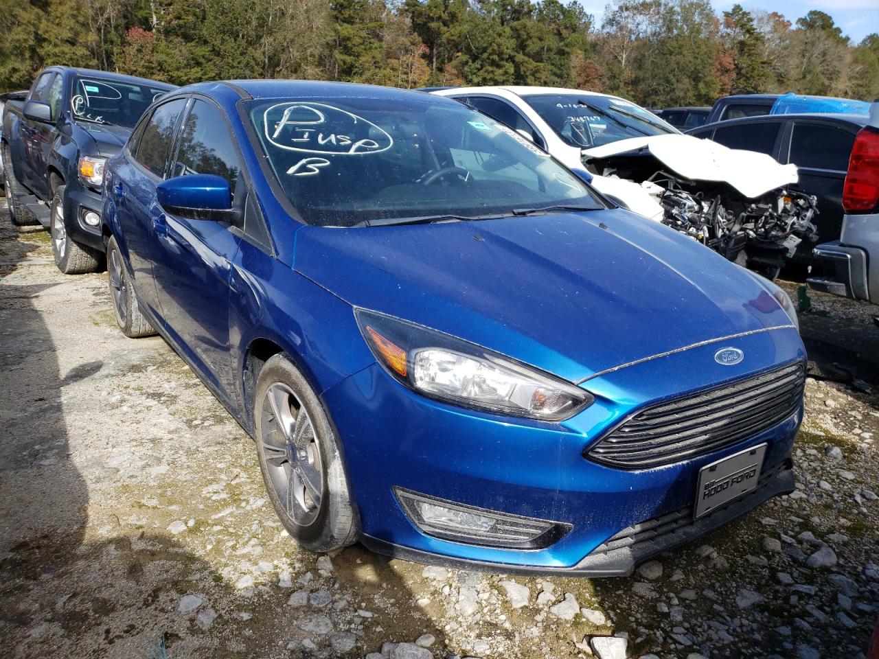 FORD FOCUS SE 2018 with VIN 1FADP3FE7JL302862 - Photo from auction