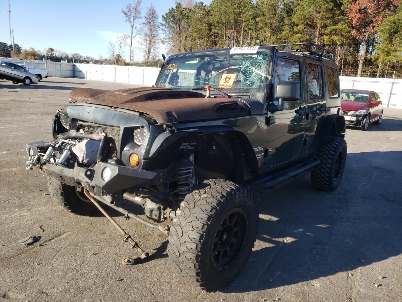 Foto 2 de la subasta – 2011 JEEP WRANGLER U con VIN 1J4BA3H11BL575255