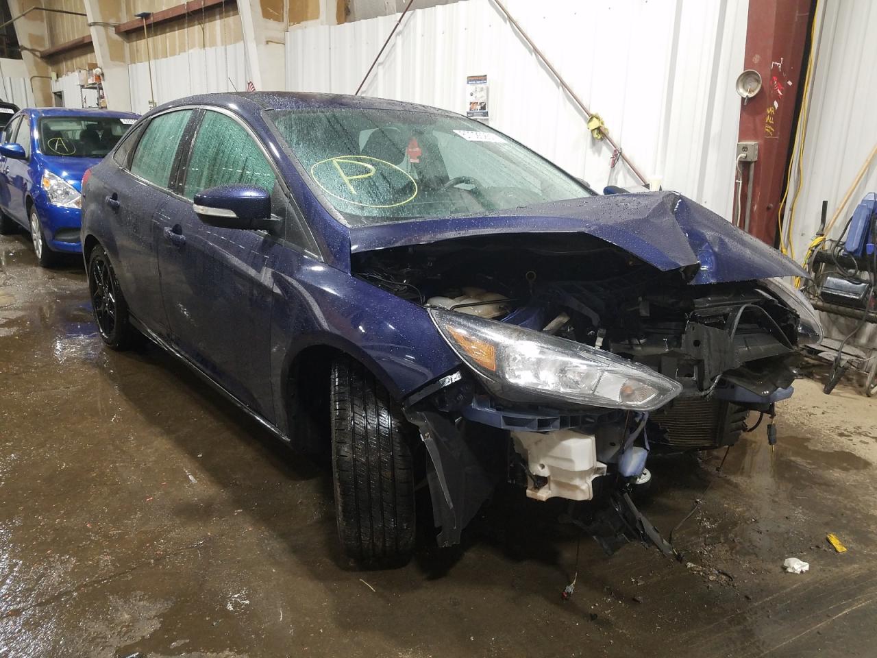 FORD FOCUS SE 2016 with VIN 1FADP3F2XGL311022 - Photo from auction