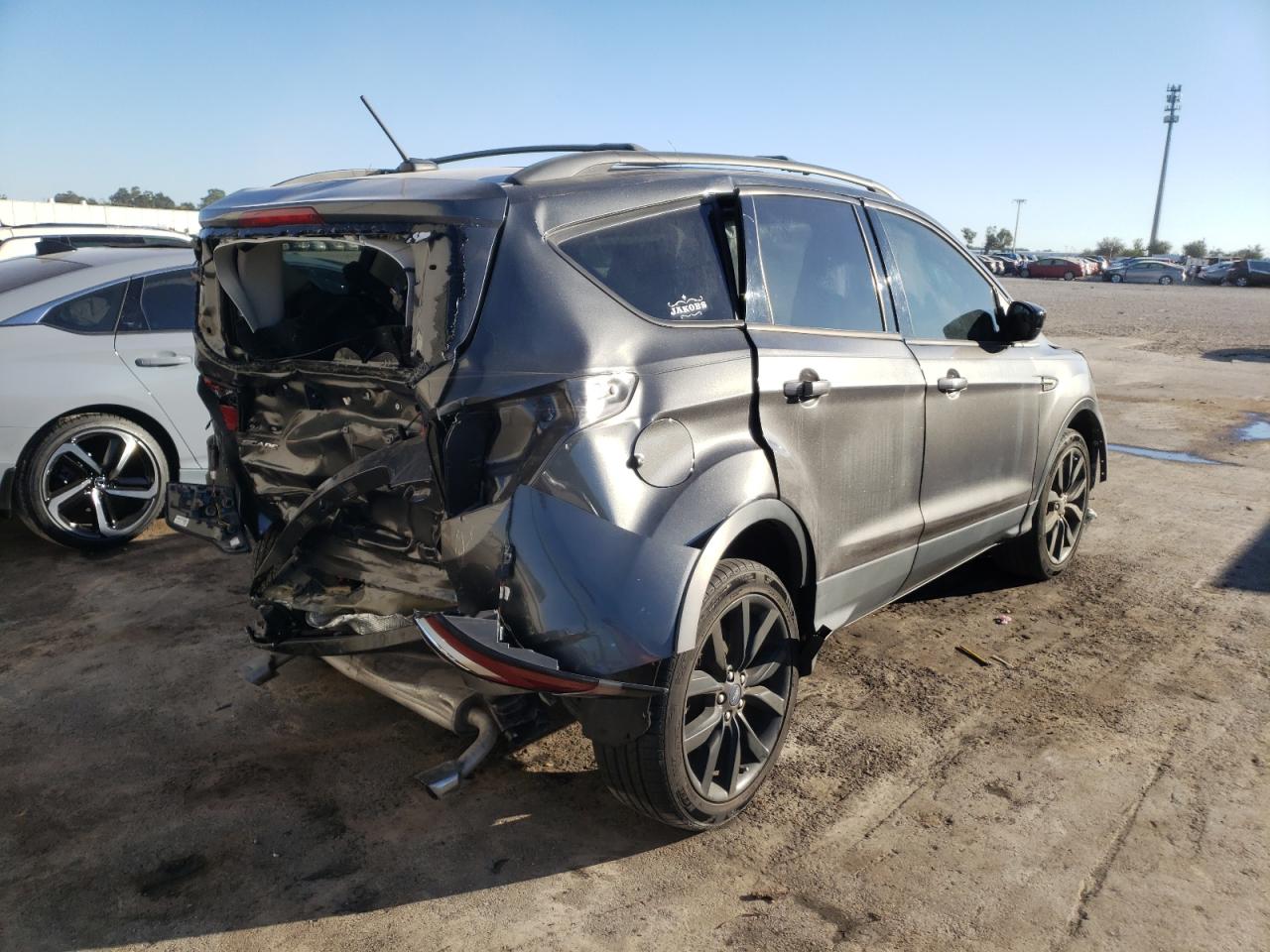 Photo 4 from auction – 2018 FORD ESCAPE SE with VIN 1FMCU0GD2JUA02199
