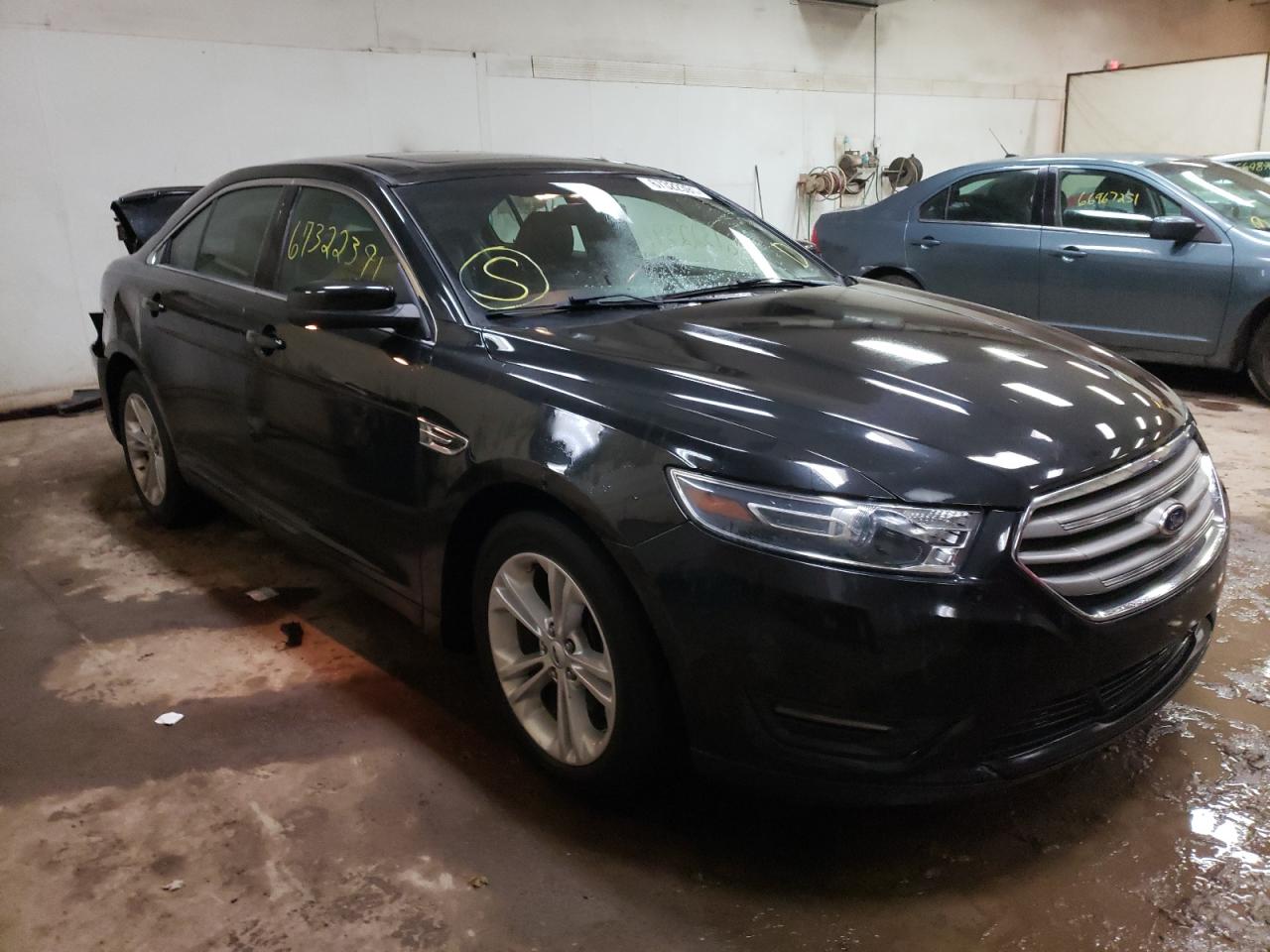 FORD TAURUS SEL 2014 with VIN 1FAHP2E80EG164412 - Photo from auction
