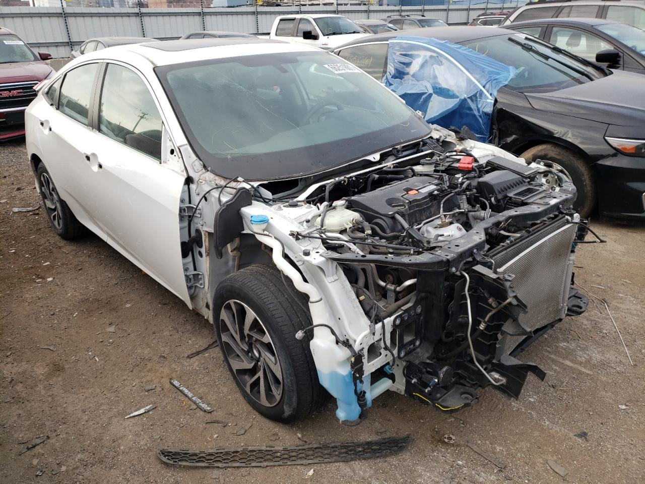 HONDA CIVIC EX 2018 with VIN 19XFC2F73JE002805 - Photo from auction