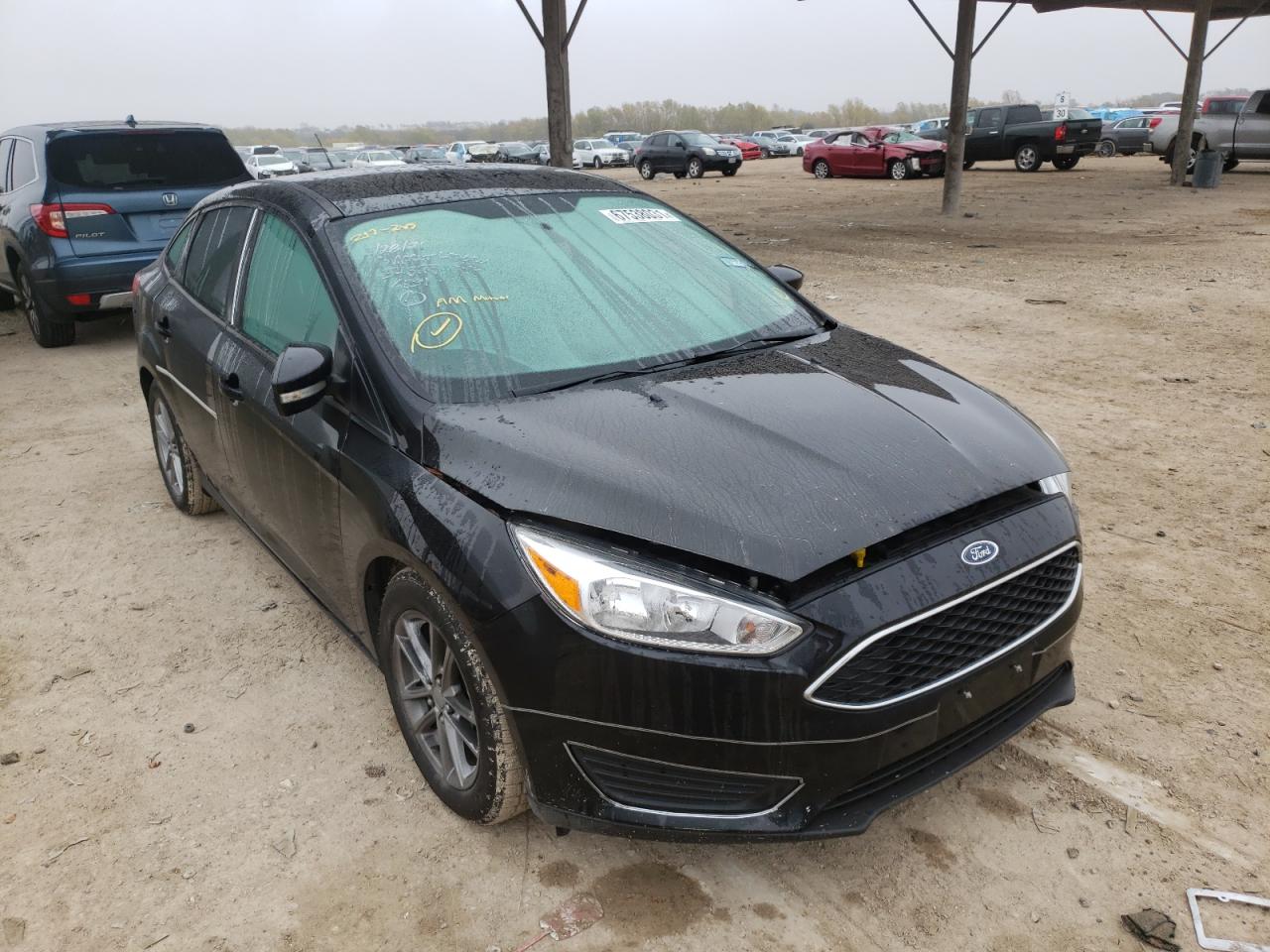 FORD FOCUS SE 2016 with VIN 1FADP3F20GL217246 - Photo from auction