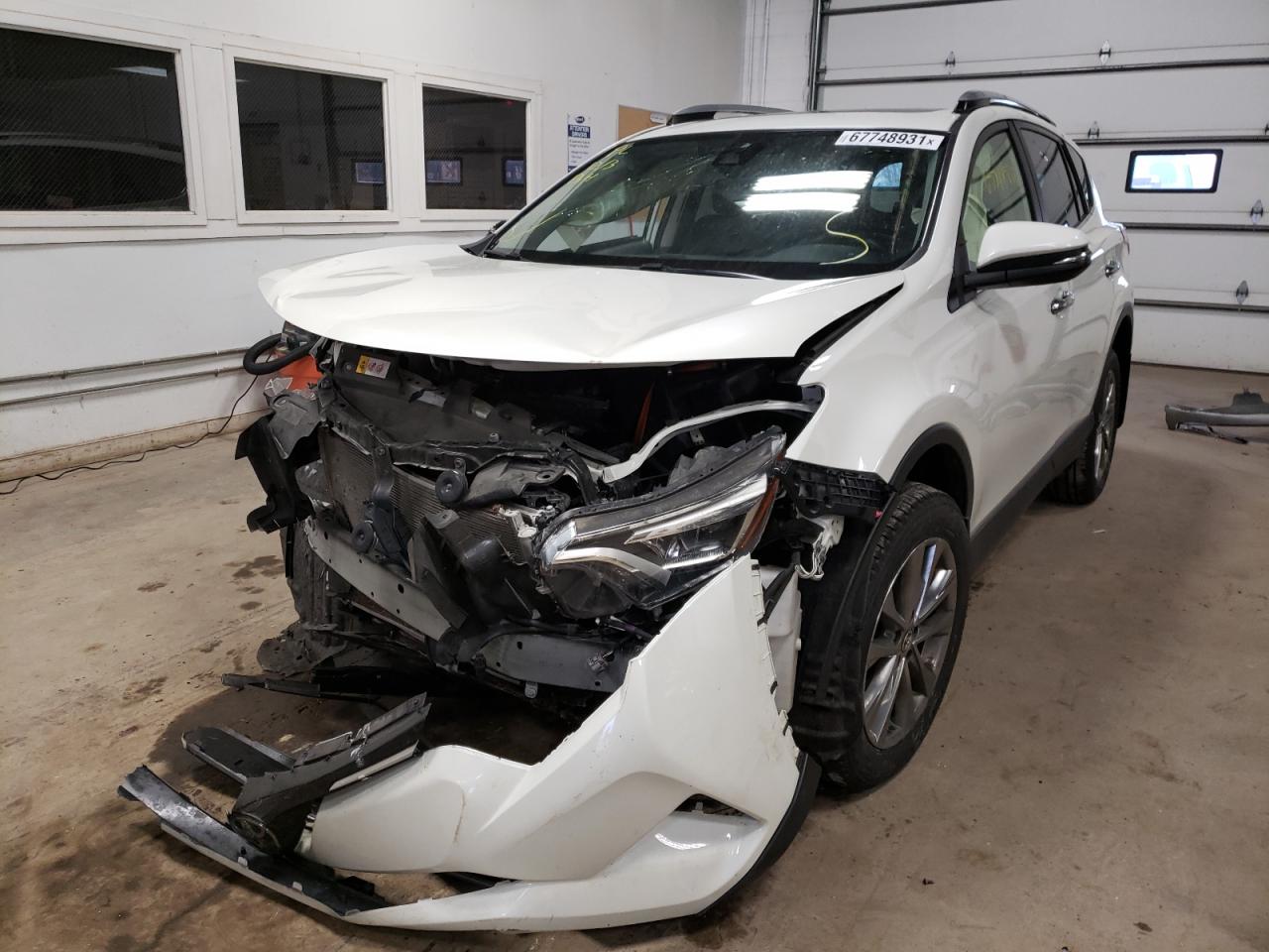Photo 2 from auction – 2018 TOYOTA RAV4 LIMIT with VIN JTMDFREV1JJ178617