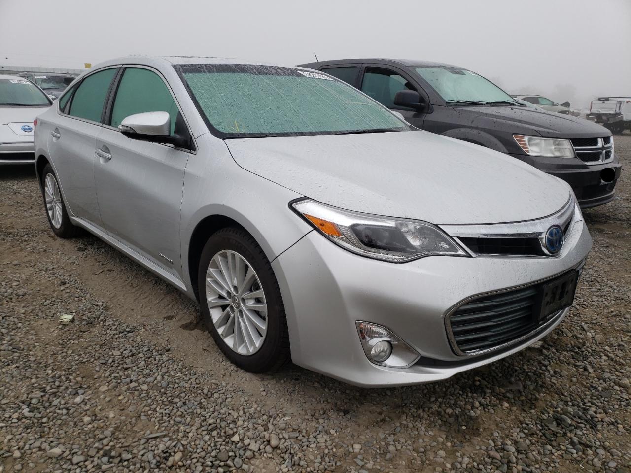 TOYOTA AVALON HYB 2014 with VIN 4T1BD1EBXEU019261 - Photo from auction