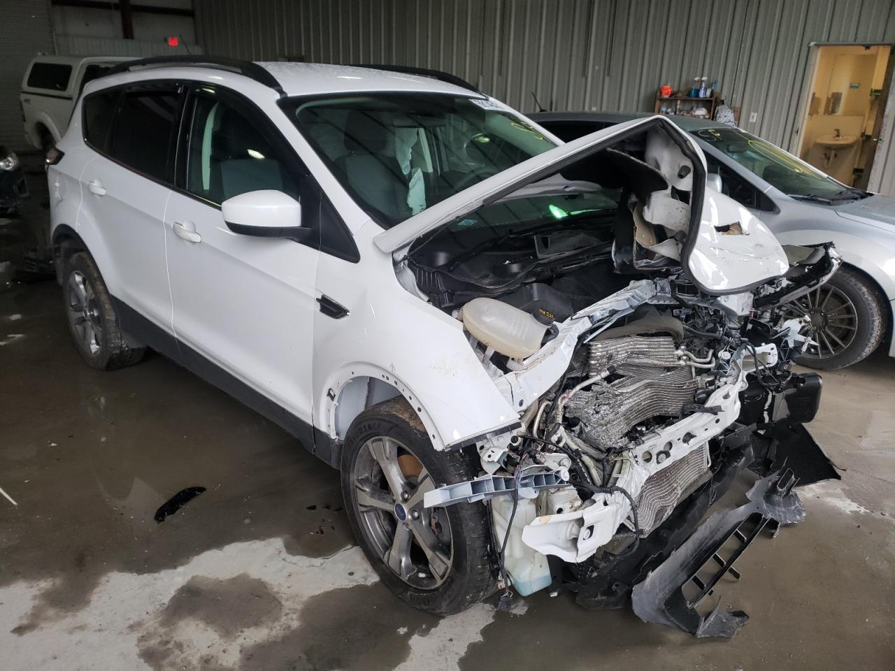 FORD ESCAPE SE 2017 with VIN 1FMCU9G90HUC83705 - Photo from auction