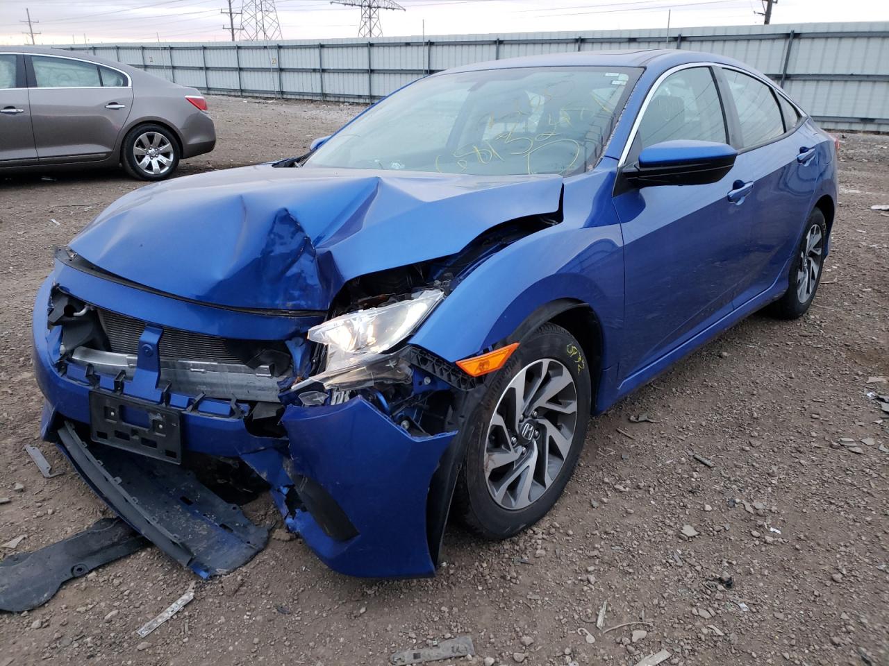 Photo 2 from auction – 2018 HONDA CIVIC EX with VIN 19XFC2F79JE035100