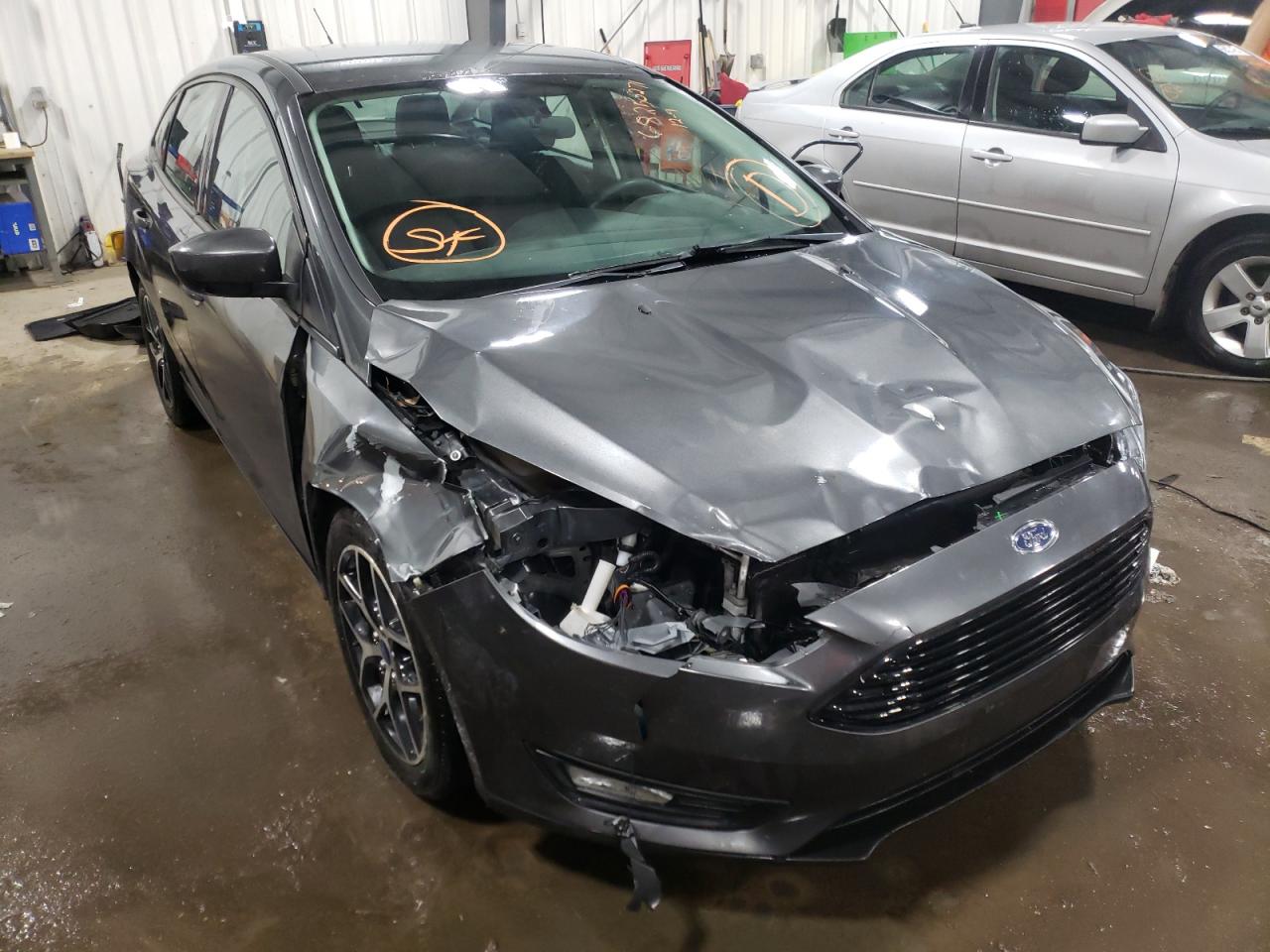 FORD FOCUS SE 2018 with VIN 1FADP3FE6JL287383 - Photo from auction