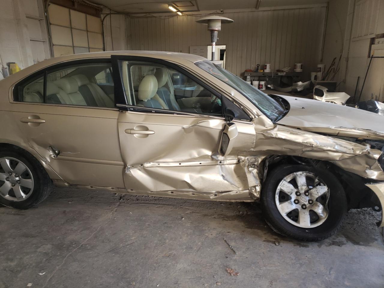 Photo 9 from auction – 2007 KIA OPTIMA LX with VIN KNAGE123775119963